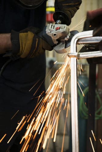 FMW|FabLab worker grinding